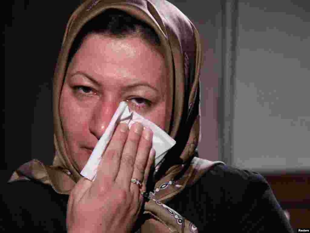 Sakineh Mohammadi Ashtiani, an Iranian woman sentenced to death by stoning, cries during an interview with Iran's English-language Press TV in an image released on December 9. The stoning sentence against Ashtiani, who is charged with adultery and murdering her husband, has raised an outcry from human rights defenders. Photo by Reuters/Press TV 