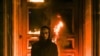 Петр Павленский на фоне горящей двери здания ФСБ 