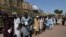 Afghan refugees wait for their registration at the UNHCR repatriation center on the outskirts of Peshawar on September 7.