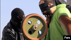 A blindfolded, convicted thief is shown at his public hand amputation in Shiraz in January 2013.