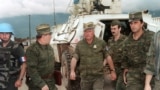 Bosnia-Herzegovina - This file photo taken in Sarajevo on August 10, 1993 shows Commander of Serbian forces in Bosnia General Ratko Mladic (C) arriving at the airport of Sarajevo.