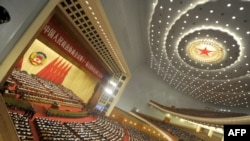 Delegates attend the opening session of the Chinese People's Political Consultative Conference (CPPCC) in the Great Hall of the People in Beijing on March 3.