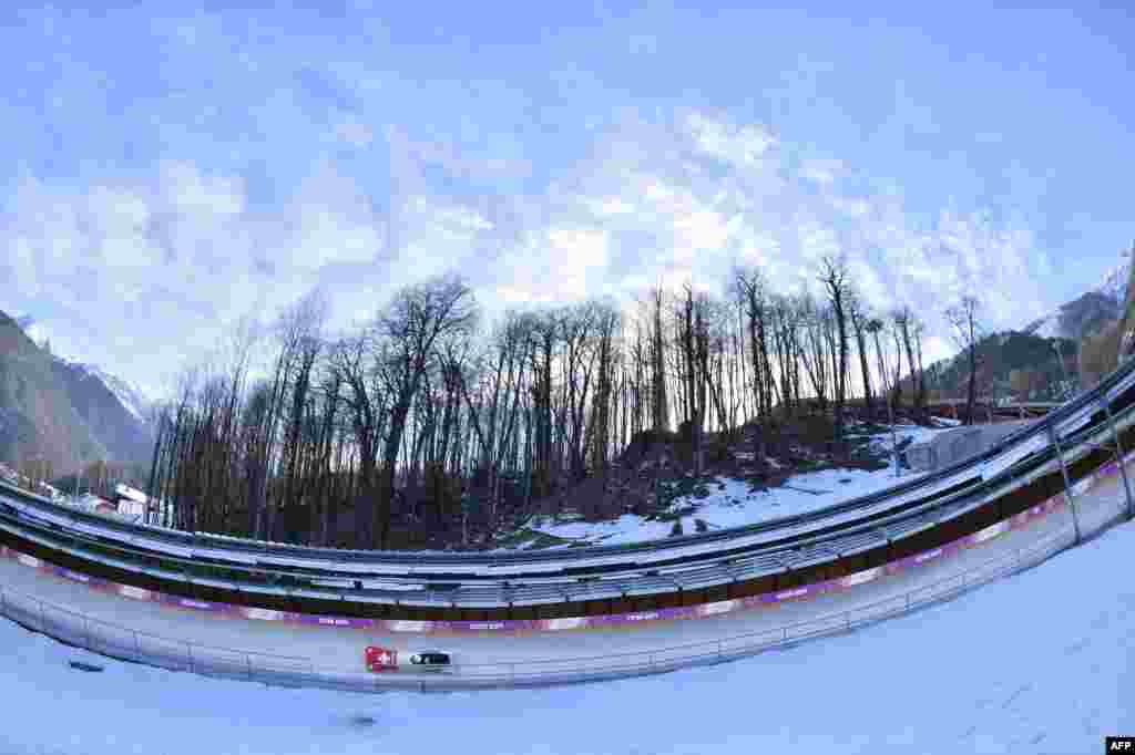 Switzerland's two-woman bobsleigh steered by Fabienne Meyer takes a practice run during a training session at the Sanki Sliding Center in Rosa Khutor. (AFP/ Lionel Bonaventure)