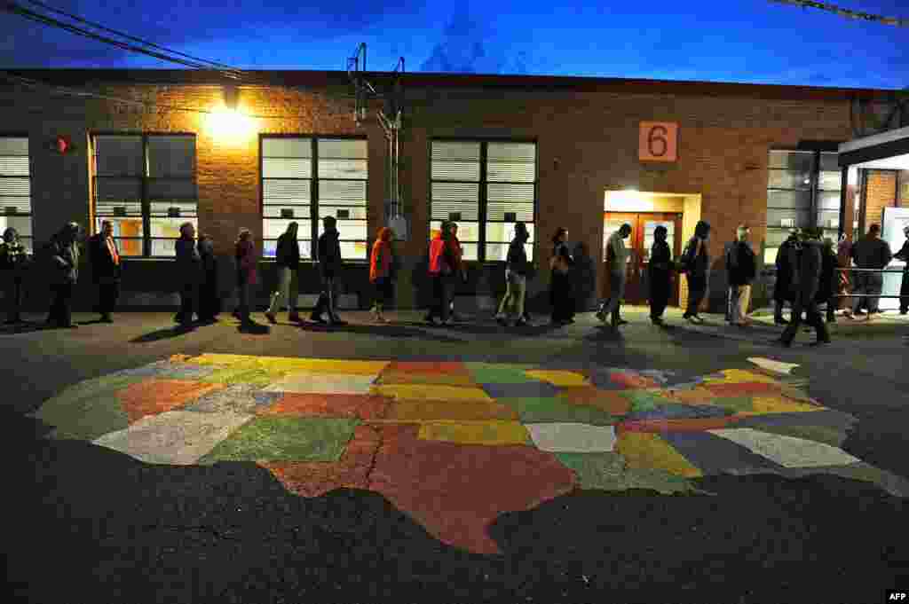 People enter Washington Mill Elementary School to cast their votes in Alexandria, Virginia.