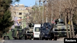 Turkey -- Military and police armored vehicles are parked in Baglar district, which is partially under curfew, in the Kurdish-dominated southeastern city of Diyarbakir, March 17, 2016