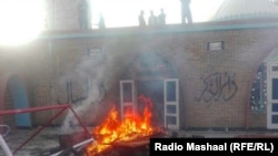 FILE: The aftermath of a an attack on an Ahmadi mosque in Chakwal, a city in the eastern Punjab Province in 2016.