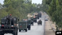 Pakistani army vehicles head towards North Waziristan on June 19, 2014.