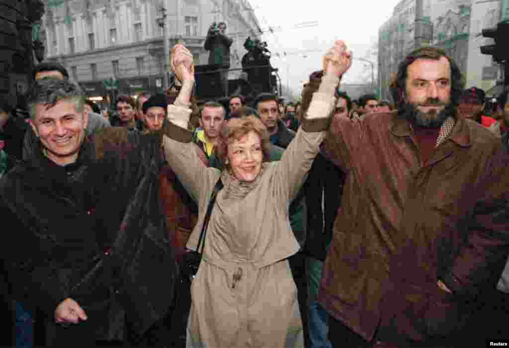 Djindjic joins hands with fellow opposition leaders Vesna Pesic and&nbsp;Vuk Draskovic during a protest against then-Serbian President Slobodan Milosevic on December 4, 1996.