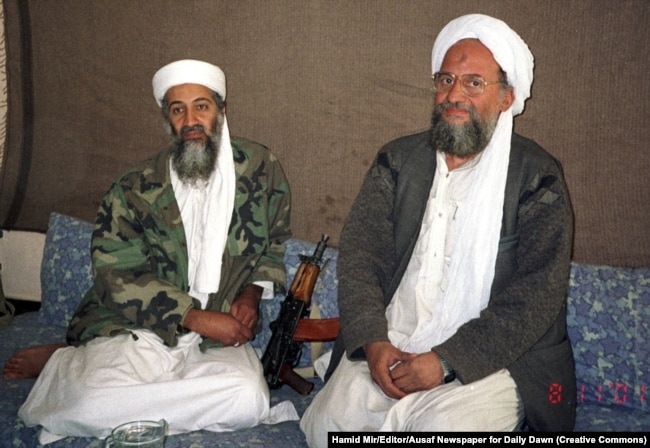 Zawahri (right) sits beside Osama bin Laden in November 2001.