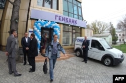 Visitors leave a newly opened branch of Genbank in the Crimean capital Simferopol in April 2014.