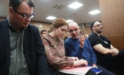 Kirill Serebrennikov (far right) with the other three defendants in the case: Yury Itin (left); Sofia Apfelbaum (second from left); and Aleksei Malobrodsky. (file photo)