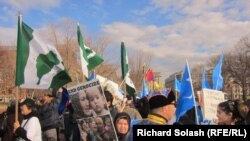 Protesters rally in front of the White House to press human rights concerns during Chinese President Hu Jintao's state visit, January 19