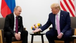 JAPAN -- U.S. President Donald Trump gestures during a bilateral meeting with Russia's President Vladimir Putin at the G20 leaders summit in Osaka, Japan, June 28, 2019.