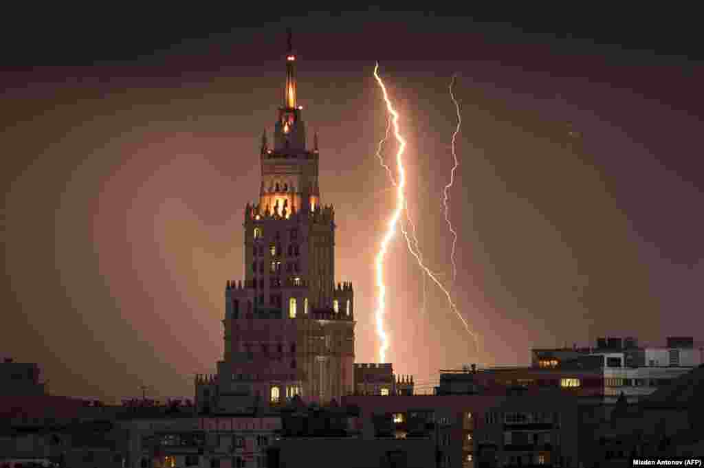 A lightning bolt is seen striking a Stalin-era skyscraper during a storm over Moscow on August 14. (AFP/Mladen Antonov)
