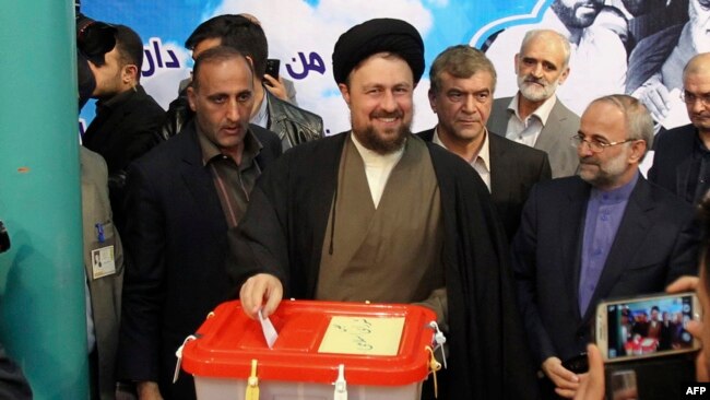 Ahmad Khomeini suggested that those behind the controversy were targeting his father, Hassan Khomeini (center).