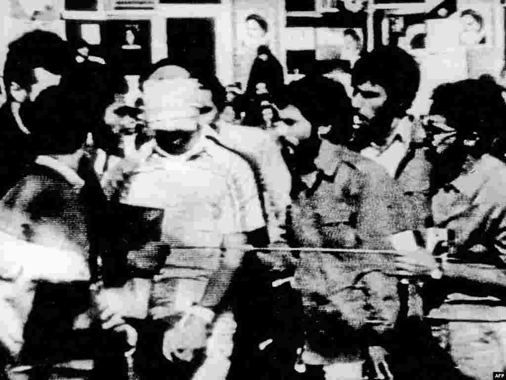 Iran -- A blindfolded US hostage is paraded by his captors at the compound of the US Embassy in Tehran, 08Nov1979 - IRAN, Tehran : This file photo shows a blindfolded US hostage on November 08, 1979 being paraded by his captors in the compound of the US Embassy Tehran, Iran. Five 