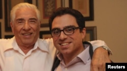 A photo shows Iranian-American consultant Siamak Namazi (right) and father Baquer Namazi, both of whom had been held in Iran.