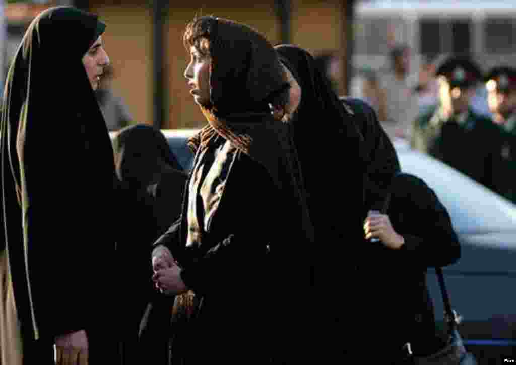 Police and Basij activists check women for proper dress in Tehran on April 22 (Fars) - Human rights activists consider imposing the Islamic hejab on women a form of violence against women, and they argue that women should be able to decide such matters themselves. (Golnaz Esfandiari) (Watch a video of a woman being detained recently in Tehran.)