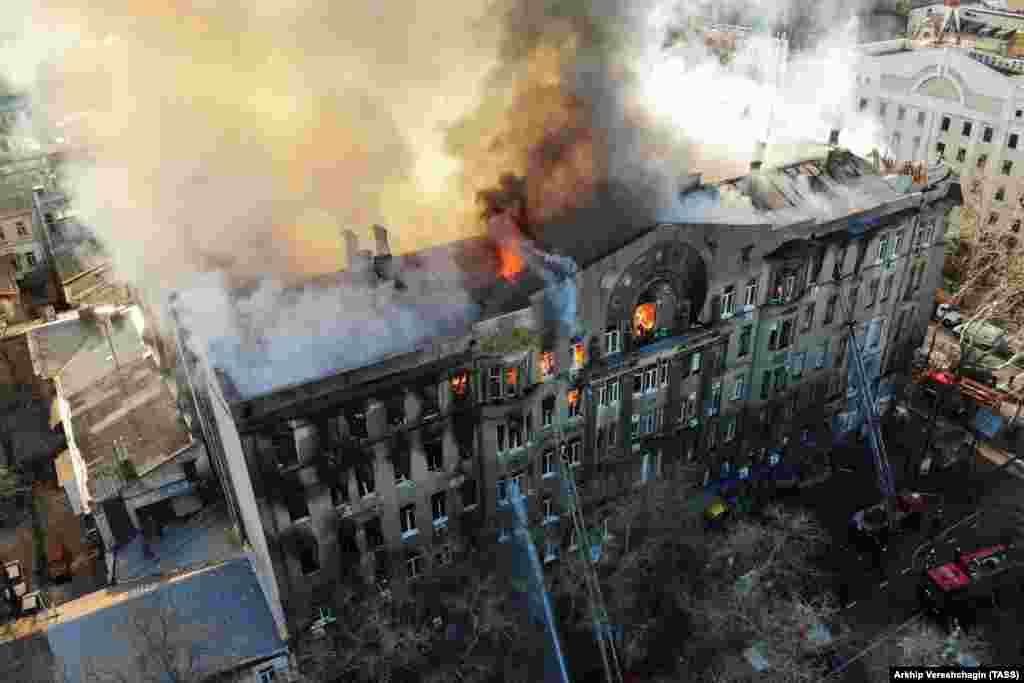 Ukrainian firefighters try to extinguish a fire engulfing a college building in central Odesa. (TASS/Arkhip Vereshchagin)