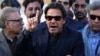 Imran Khan, chairman of the Pakistan Tehreek-e-Insaf (PTI) political party, addresses the media after the Supreme Court dismissed a petition to disqualify him from parliament for not declaring assets on December 15.