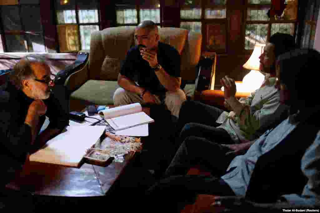 IRAQ - Director Hassan Husni (L) speaks to Iraqi actors to prepare for a scene of the hotel TV series, which is being filmed and broadcast during the Muslim holy month of Ramadan, in Baghdad, Iraq May 10, 2019