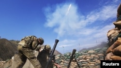 FILE: U.S. soldiers fire 81mm mortar rounds at suspected insurgent positions in the Pech Valley.