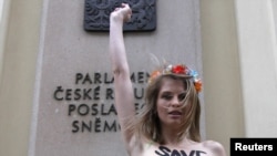 In what she describes as a "cry of despair," Hagen protested topless in front of the Czech parliament building earlier this month.