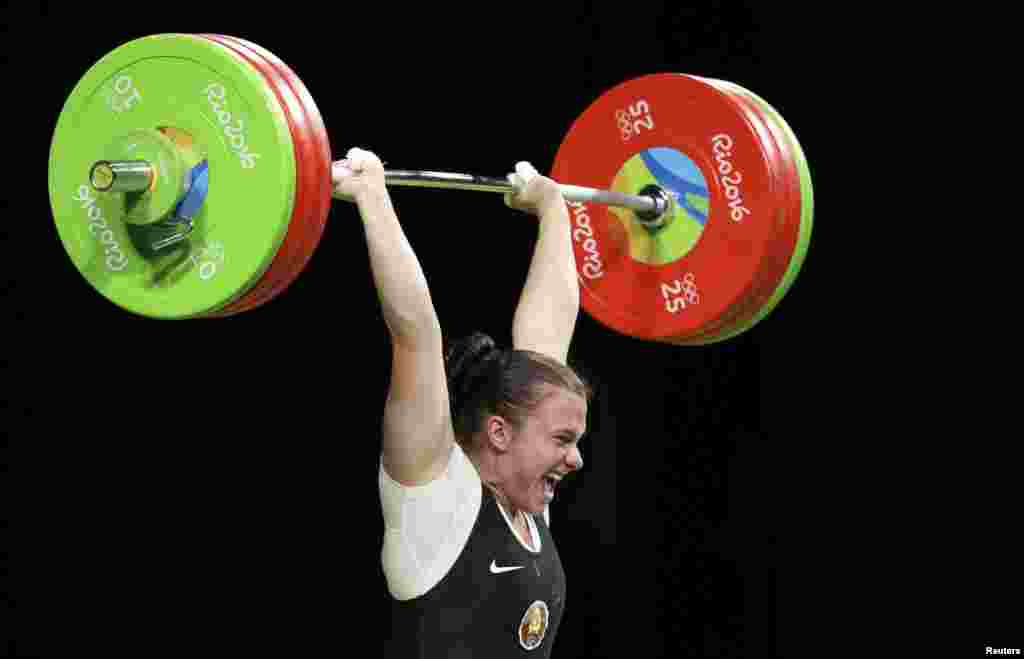 Darya Naumava of Belarus competes in the weightlifting women&#39;s 75-kilogram final.