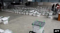 Kosovo -- Election activists prepare ballot boxes at the counting centre in Kosovo Polje, 11Dec2010