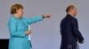 Angela Merkel și ministrul de finanțe Olaf Scholz în timpul unei discuții despre evoluția economiei după Covid-19, în Berlin, 3 iunie 2921, 