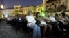 Switzerland -- Spectators on Piazza Grande watch a feature film on the eve of the 60th International Film Festival in Locarno, 31Jul2007