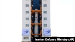 An Iranian rocket is prepared to launch carrying a satellite at the Imam Khomeini Spaceport in Iran's Semnan province, February 9, 2020