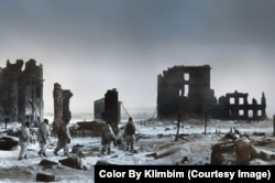 Soldiers in camouflage walk through the moonscape of Stalingrad in 1943.