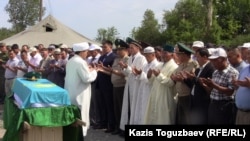 A memorial service in June 2012 for one of the 14 border guards who died in the late-May killings on the Kazakh-Chinese border.