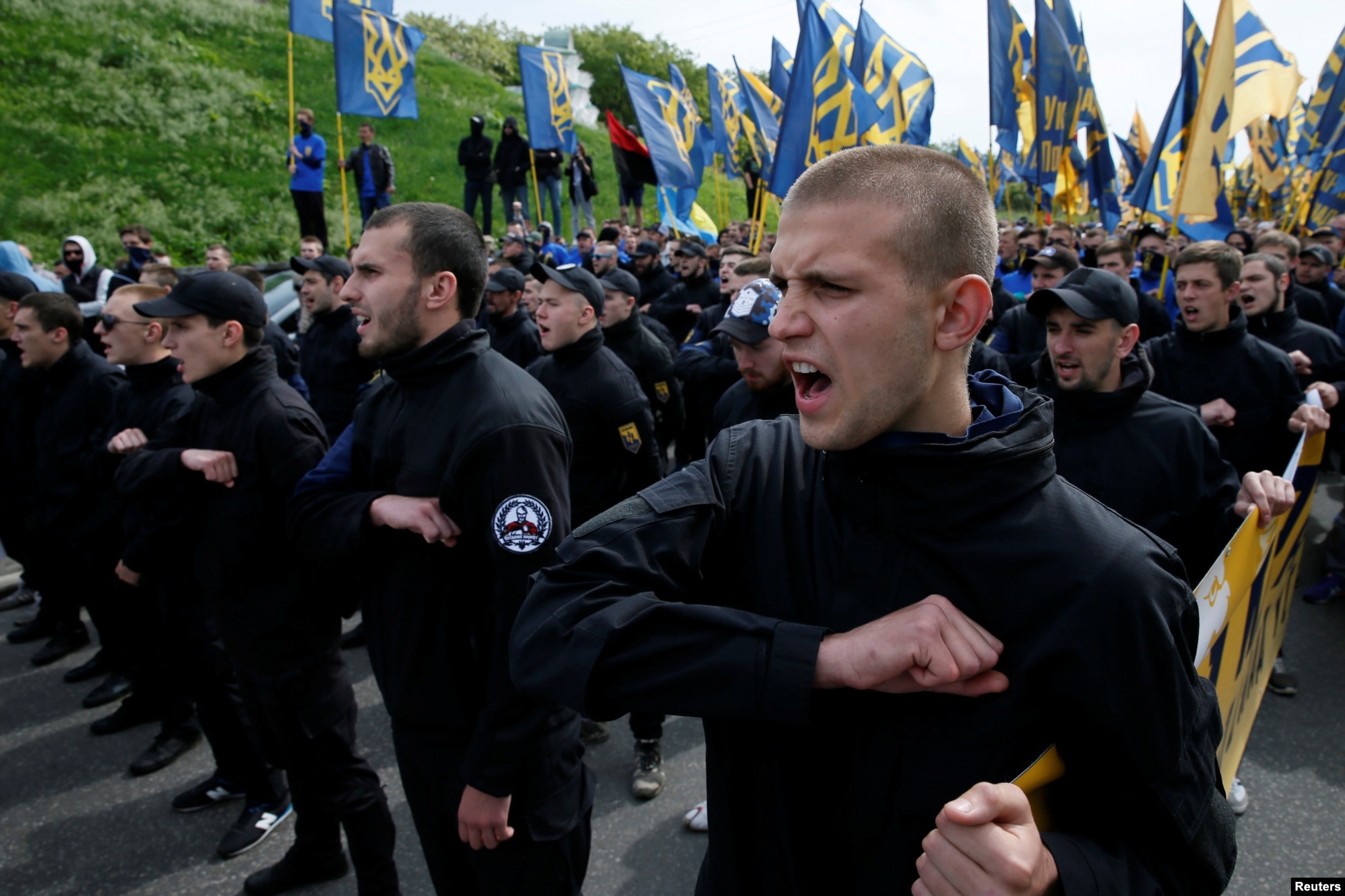 Members of the Azov Battalion attend a protest against local elections in separatist-held areas of eastern Ukraine in Kyiv on May 20, 2016.