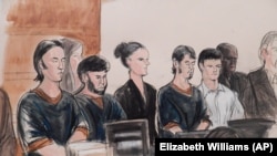 Seen here in a courtroom sketch, Dilkhayot Kasimov (fifth from left) is the latest member of a group of conspirators to be sentenced to more than a decade-long prison term.