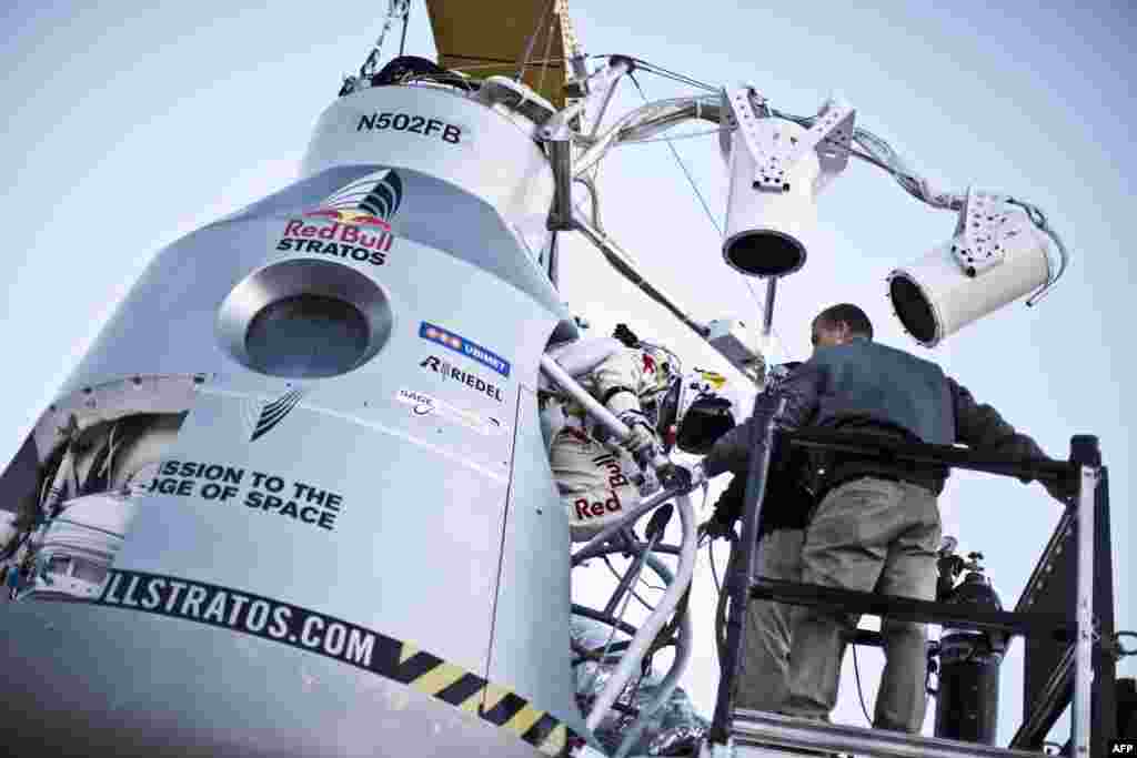 Daredevil Felix Baumgartner steps into the capsule before launch from the desert surrounding Roswell, New Mexico, on October 14.