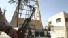 A security guard stands in front of the Syrian Catholic Church in Baghdad's district of Karrada.