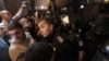 Напрежението между полицаи и протестиращи във вторник в София ескалира, след като група младежи с качулки атакуваха входа на втората сграда на парламента с бомбички, боя, камъни и бутилки със запалителни течности