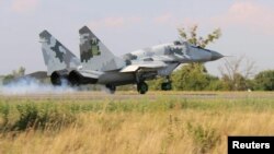 A Ukrainian Mikoyan MiG-29 jet fighter lands in the northwestern Rivne region during military aviation drills amid an uptick in tensions between Ukraine and Russia.