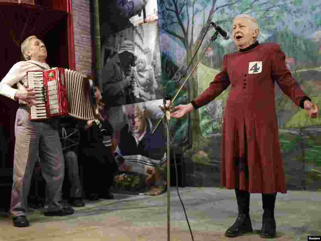 Tsiuri Kakabadze (right), 80, performs during the "Super Grandmother and Super Grandfather" contest in Tbilisi on January 5. Twenty-four participants aged over 70 from all over Georgia attended the contest. Photo by David Mdzinarishvili for Reuters