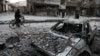 A street covered in debris from shelling in the rebel-held enclave of Eastern Ghouta