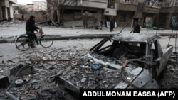 A street covered in debris from shelling in the rebel-held enclave of Eastern Ghouta