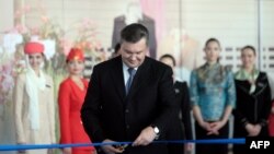 Ukrainian President Viktor Yanukovych cuts a ribbon at an opening ceremony for Sergei Prokofiev Airport in Donetsk on May 14, when he said Ukraine would not be "humiliated."