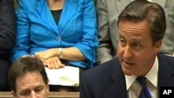 British Prime Minister David Cameron announces the UN resolution in parliament on June 8.