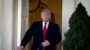 U.S. President Donald Trump exits the Oval Office prior to speaking about the government shutdown on January 25, 2019, from the Rose Garden of the White House in Washington, DC. 