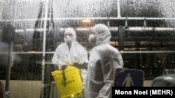Disinfecting buses in Tabriz to counter the outbreak of coronavirus on Monday, February 24, 2020.
