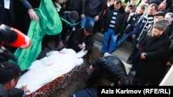 The funeral of Zaur Hasanov who died after self-immolating late last month. 