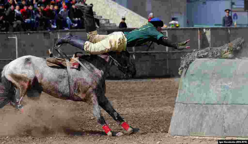 Kyrgyz horsemen participate in the traditional Central Asian sport of Kok-Boru, a competition that is held as part of Norouz celebrations in Bishkek. (epa-EFE/Igor Kovalenko)