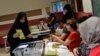 A woman votes in snap Turkish presidential and parliamentary elections in Istanbul on June 24,